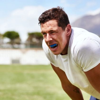 Athlete wearing a mouthguard during sports practice to protect teeth